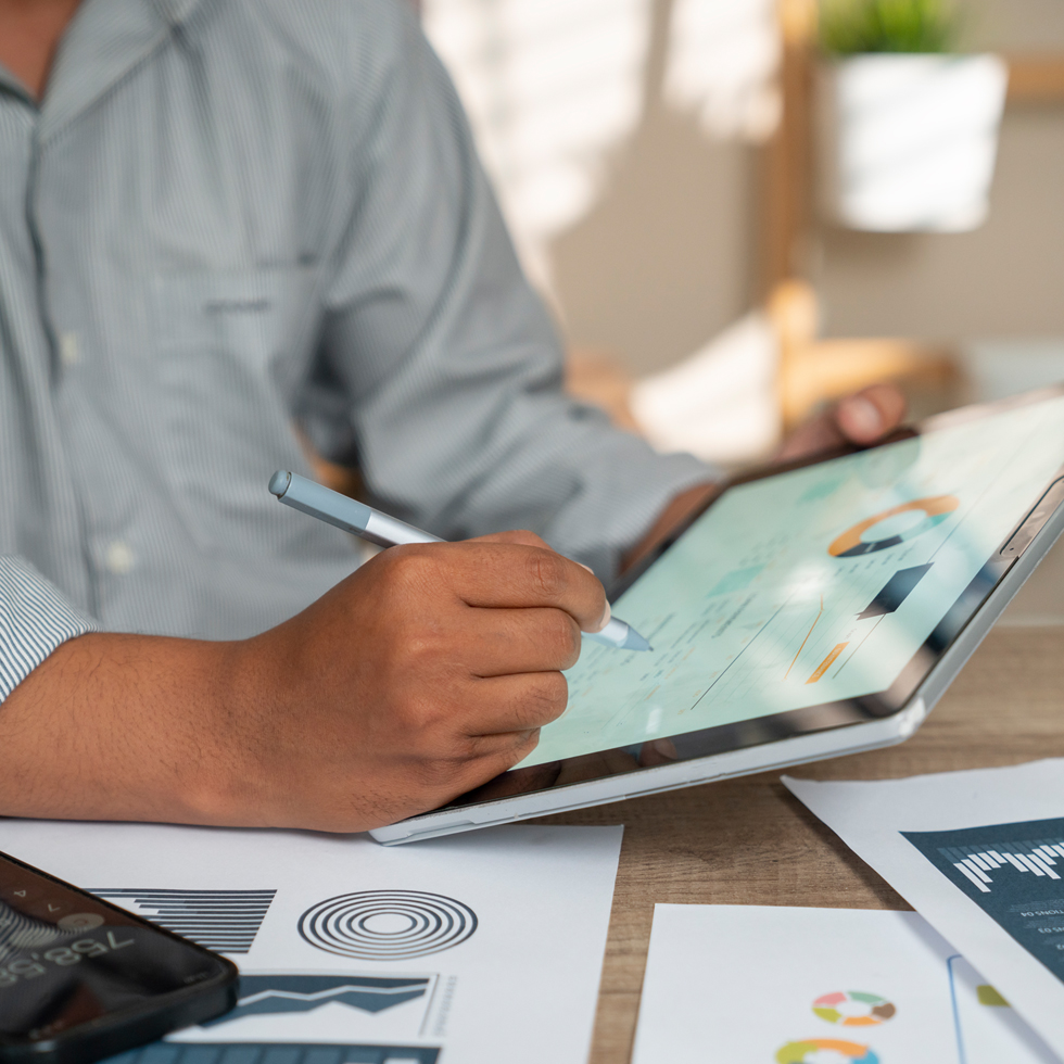 business person using tablet in office