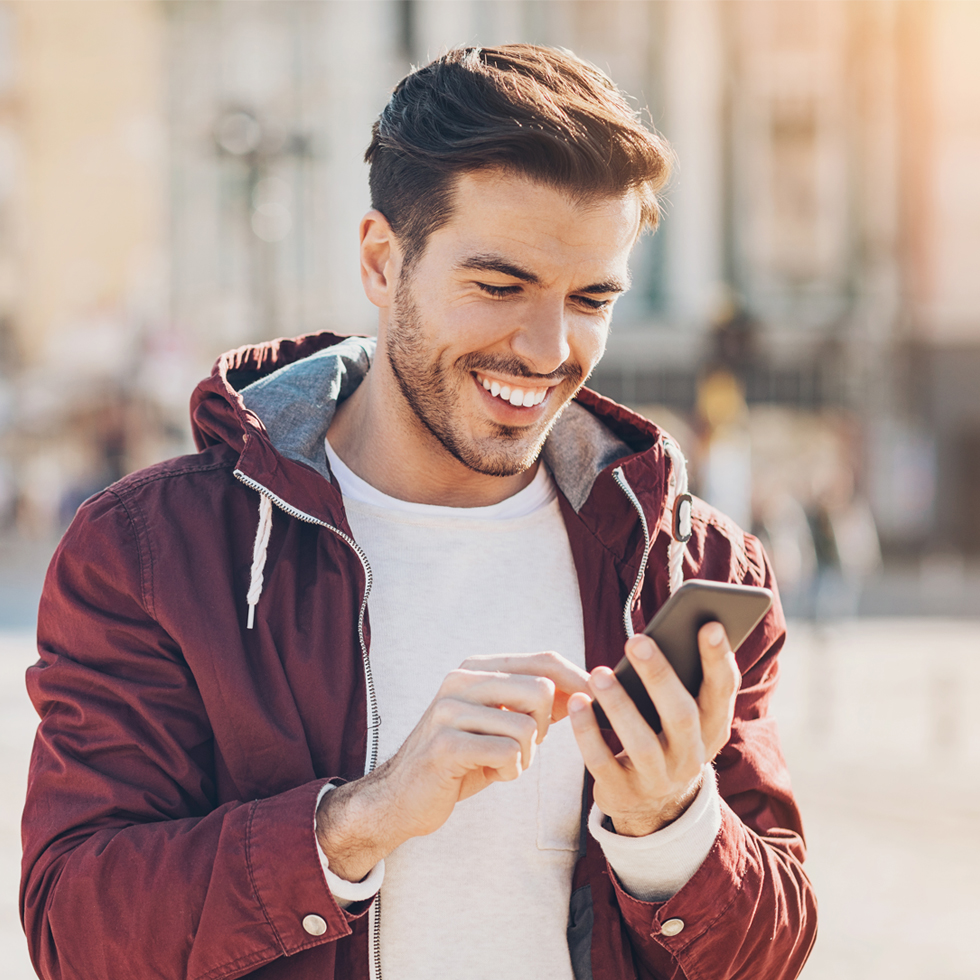 man using smartphone outside