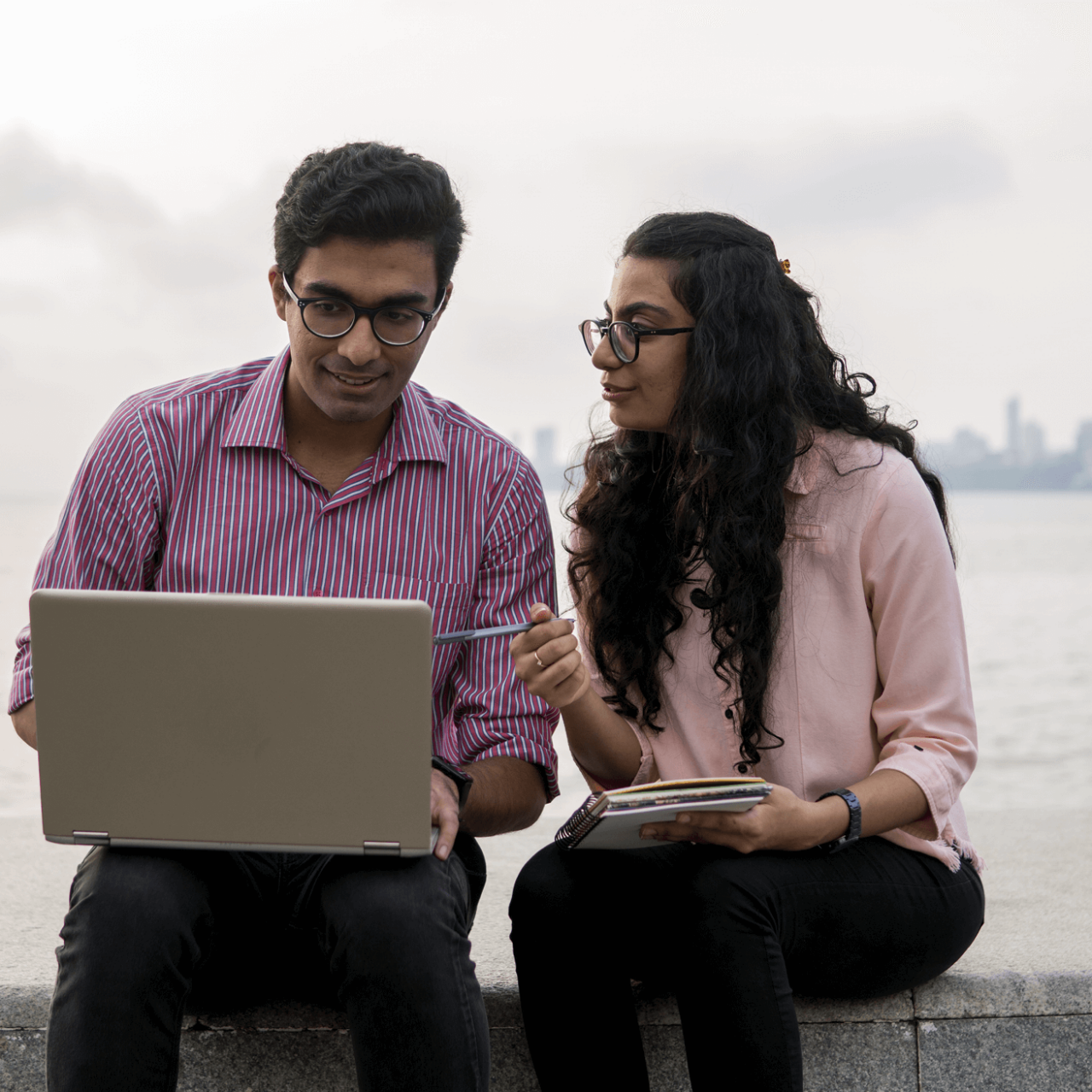 two people looking at laptop