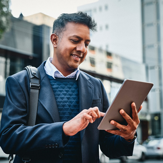 guy staring at ipad