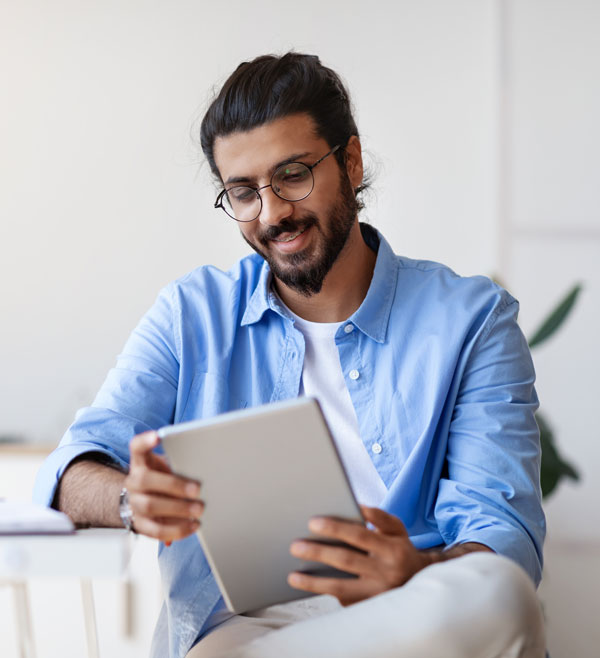 guy staring at ipad